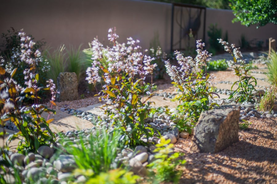 A garden with a decorative waterfall​