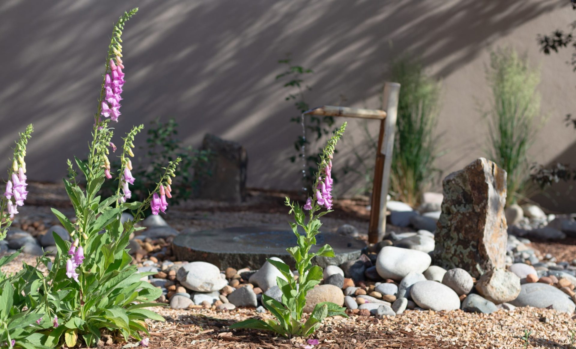 A beautiful river rock landscape by Urbanna Landscaping